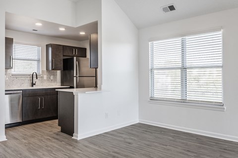 A kitchen with a stainless steel refrigerator, dishwasher, and oven. at Sundance Apartments, Indianapolis, Indiana