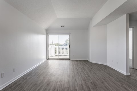 A room with a slanted ceiling and a large window. at Sundance Apartments, Indianapolis, 46237