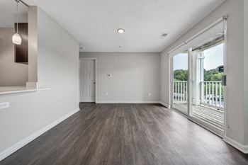 A room with a sliding glass door leading to a balcony. at Sunscape Apartments, Roanoke