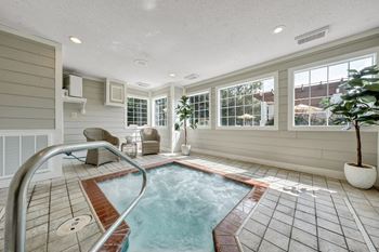 A small indoor pool with a metal ladder. at Sunscape Apartments, Virginia
