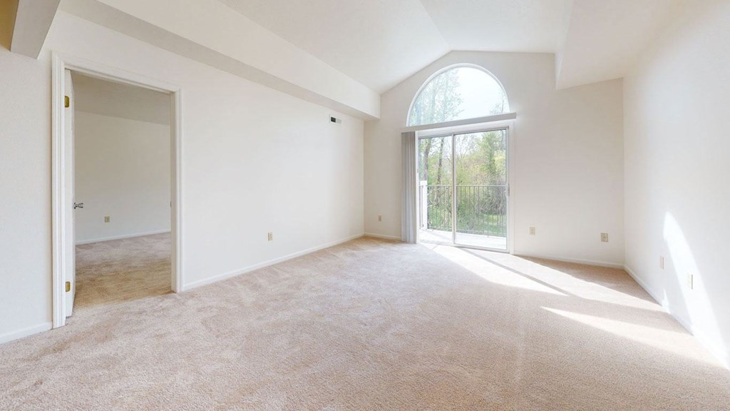 Cathedral Ceiling Leading To Private Balcony