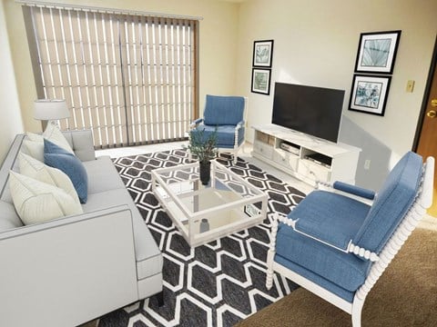 a living room with blue and white furniture and a television