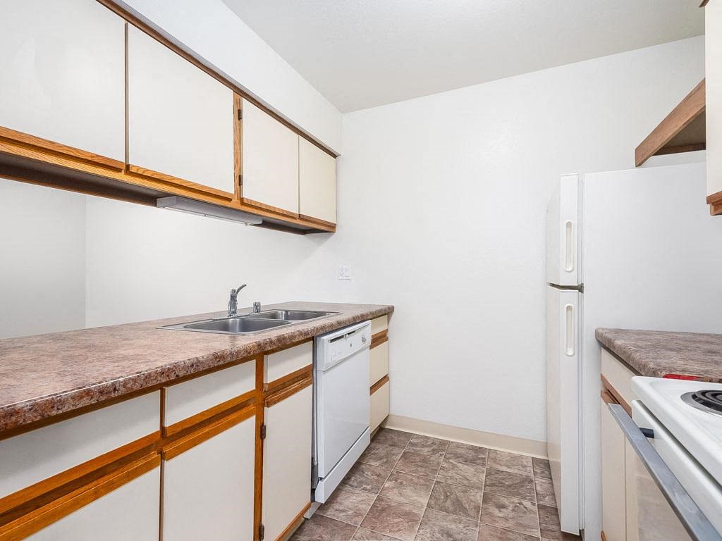 a kitchen with a dishwasher at Tanglewood Apartments, Oak Creek, WI