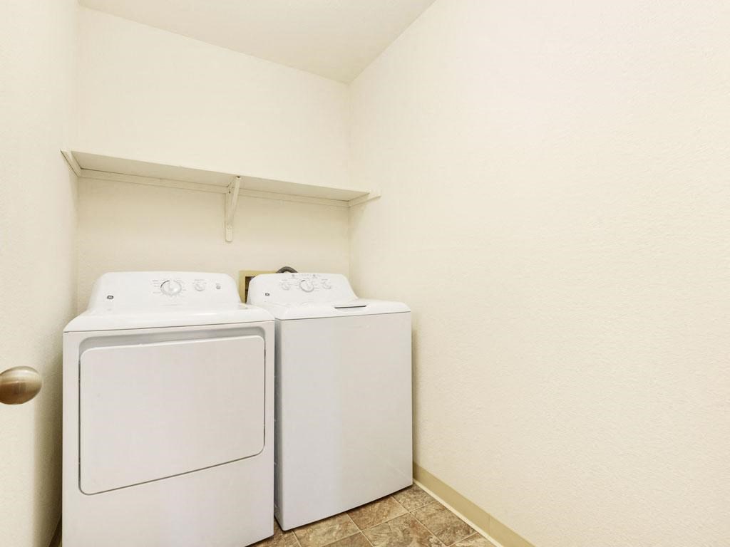 a laundry room with a washer and dryer in it at Tanglewood Apartments, Oak Creek, WI, 53154