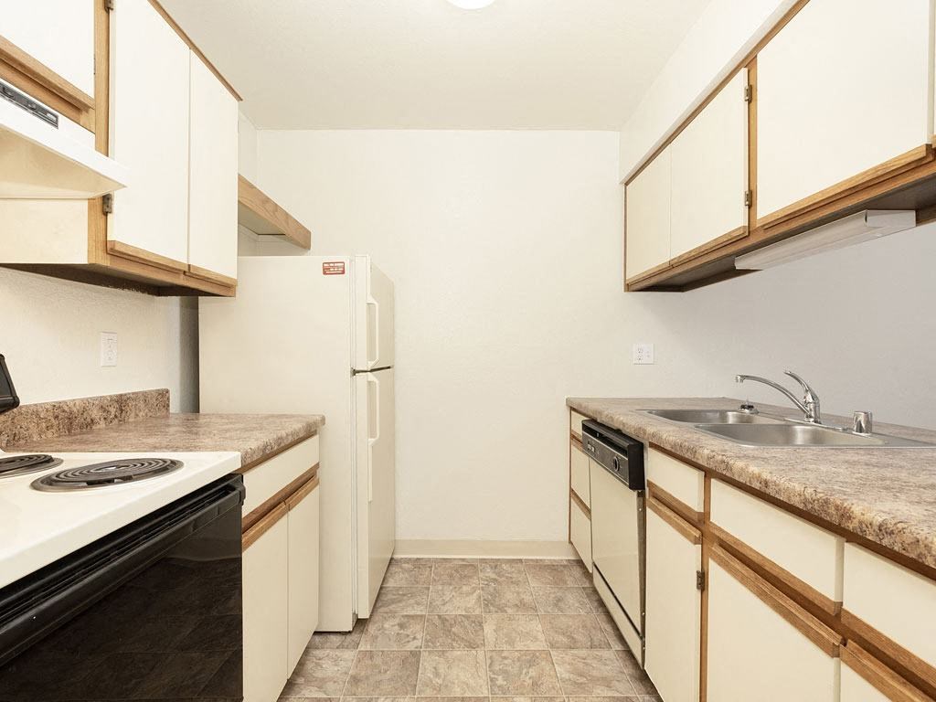 Galley-Style Kitchen at Tanglewood Apartments, Oak Creek