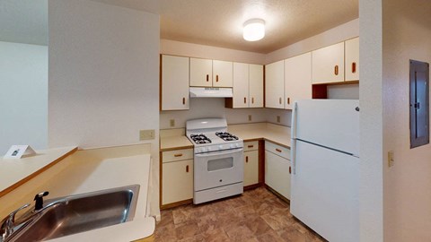 two bedroom kitchen with white appliances  at Tracy Creek Apartment Homes, Perrysburg, Ohio