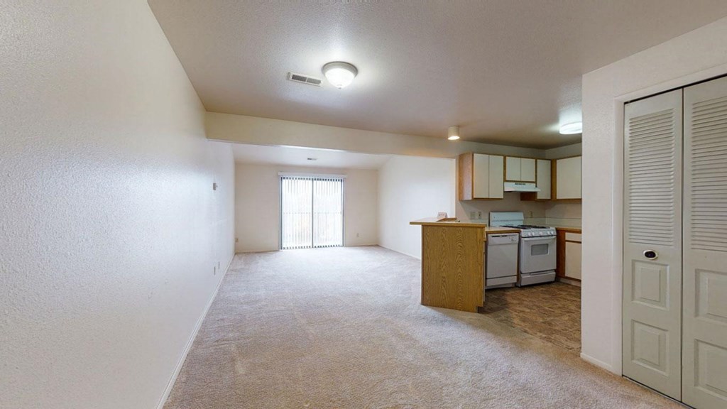 large living/dining areas and kitchen with breakfast bar  at Trappers Cove Apartments, Lansing, MI, 48910