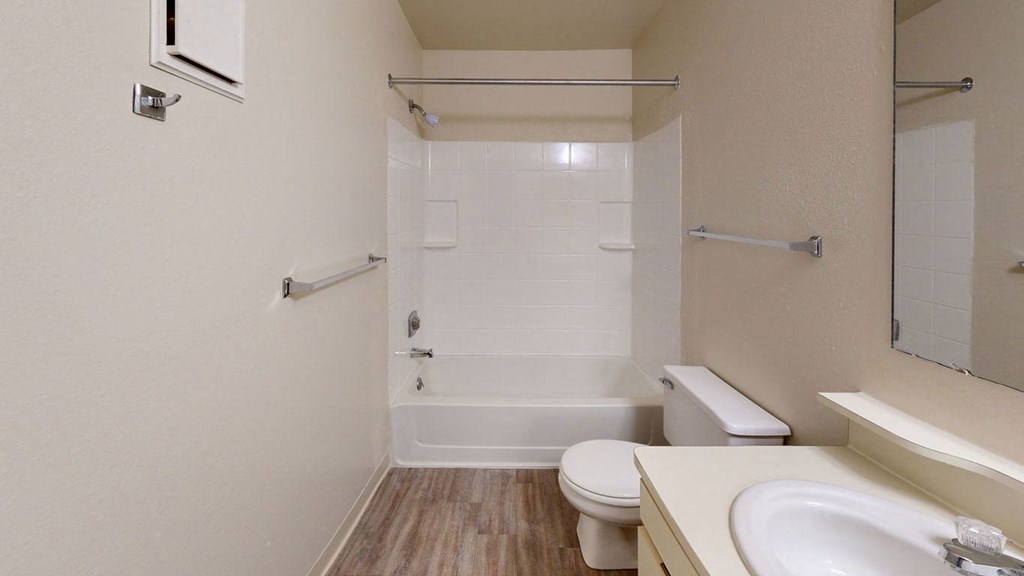 a bathroom with a sink toilet and a shower  at Trappers Cove Apartments, Lansing, Michigan