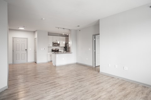 A spacious kitchen with a breakfast bar and a dining area.