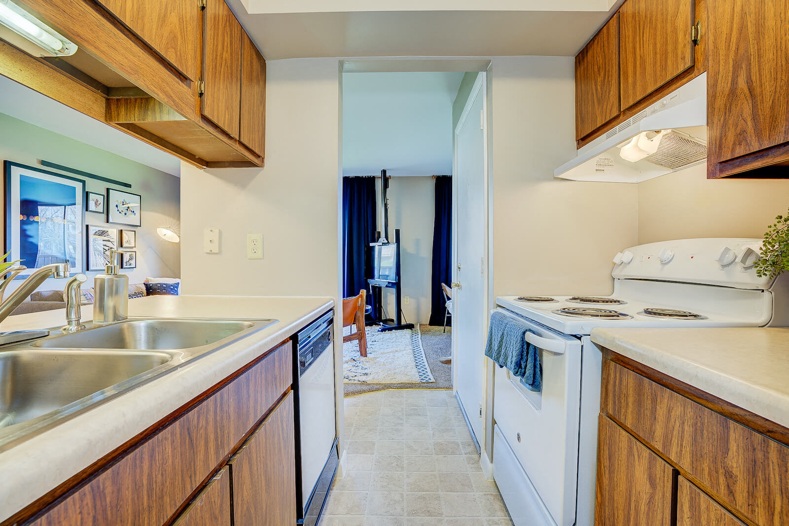 Modern Kitchen With White Appliances at Autumn Woods Apartments, Miamisburg, OH, 45342