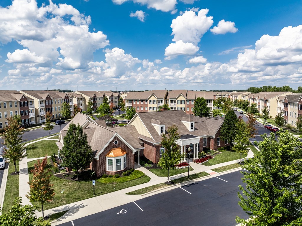 an aerial view of a community with houses and trees at The Avenue at Polaris Apartments, Ohio
