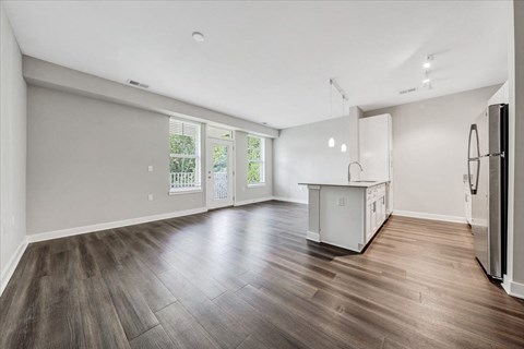 A kitchen area with a refrigerator on the right side.