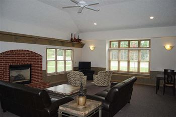 Community Clubhouse with Fireplace Seating at Trillium Pointe Apartment Homes, Jackson, MI 49201