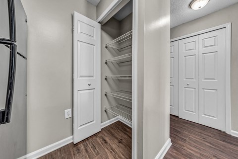 the closet in a new home with white closets and white doors at Trophy Club at Bellgrade, Midlothian, VA, 23113