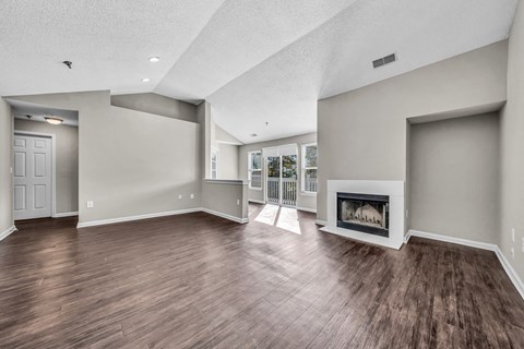the living room has a fireplace and hardwood floors at Trophy Club at Bellgrade, Midlothian, VA, 23113