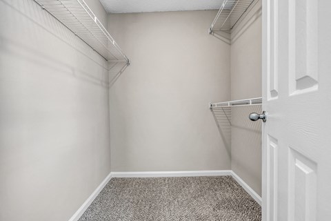 an empty closet in a home with a white door at Trophy Club at Bellgrade, Midlothian, VA, 23113