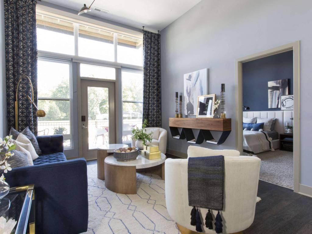 a living room filled with furniture and a large window  at Avant & Avant II, Carmel, IN, 46032