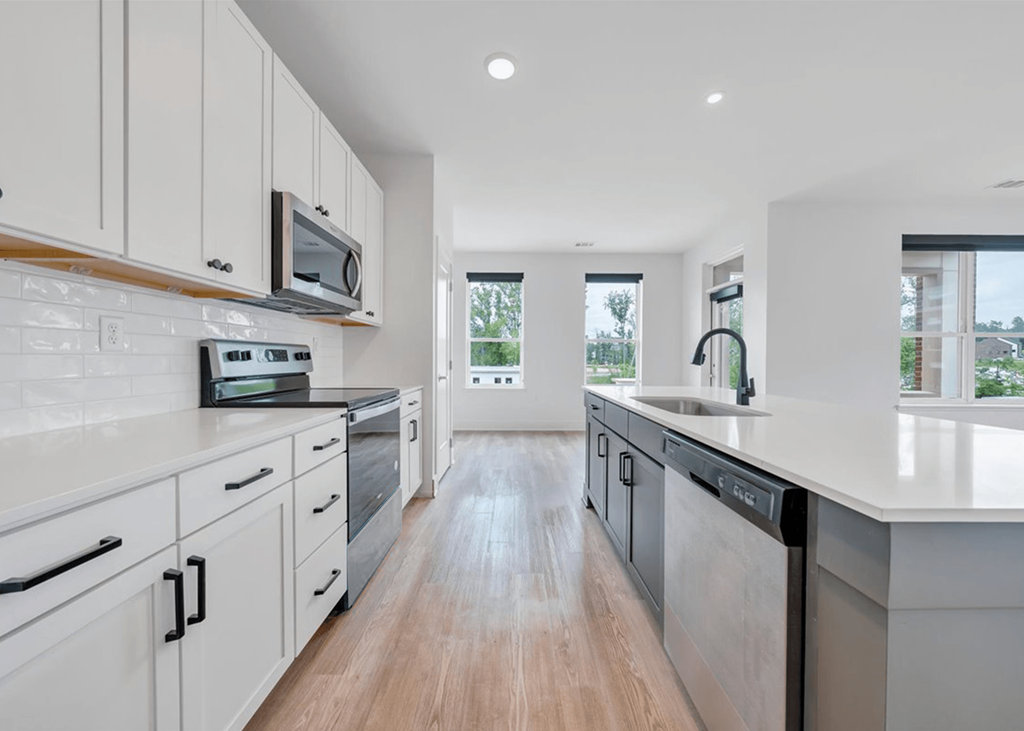 a kitchen with white cabinets and white countertops at Luxe 360 in Midlothian, Midlothian, 23114