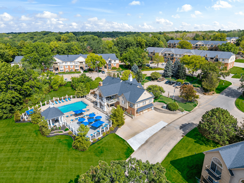A large house with a pool surrounded by trees at Timberlane Apartments, Illinois, 61615
