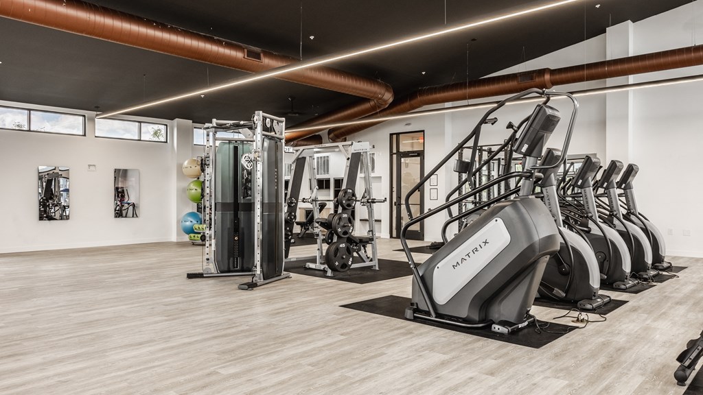 Gym with a variety of equipment including treadmills, weights, and exercise machines at Upper Vue Flats, Ohio