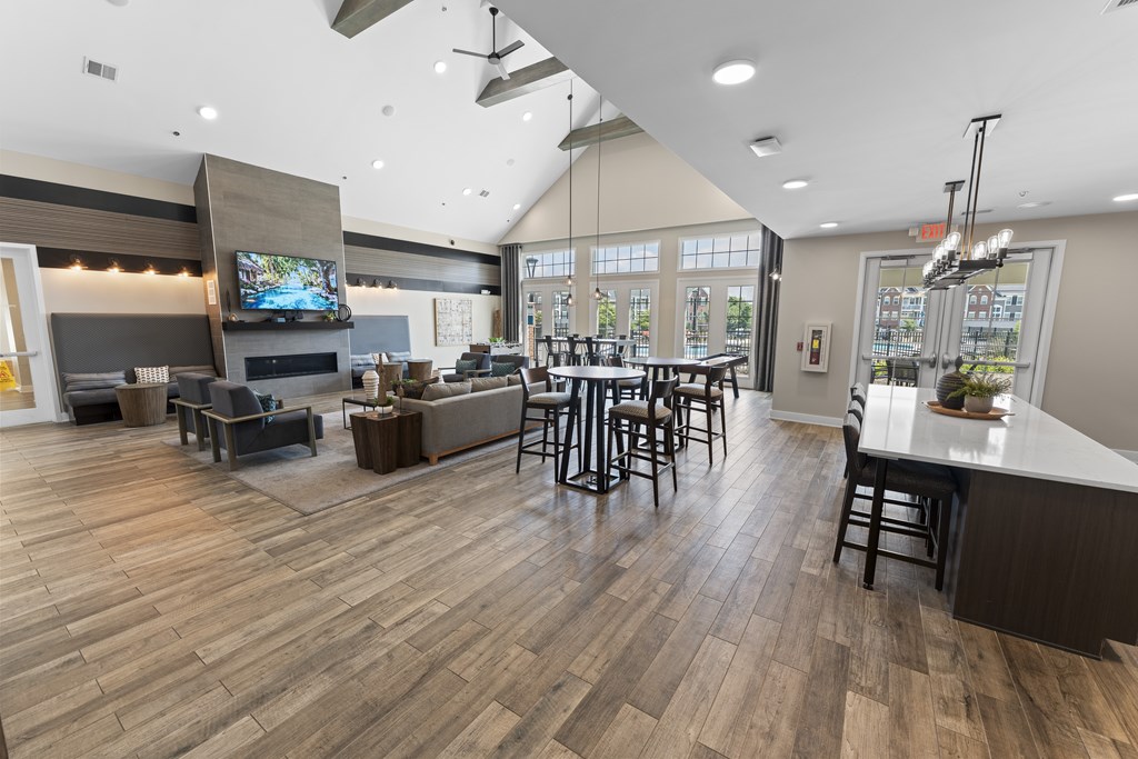 A modern open plan living and dining area with a bar.