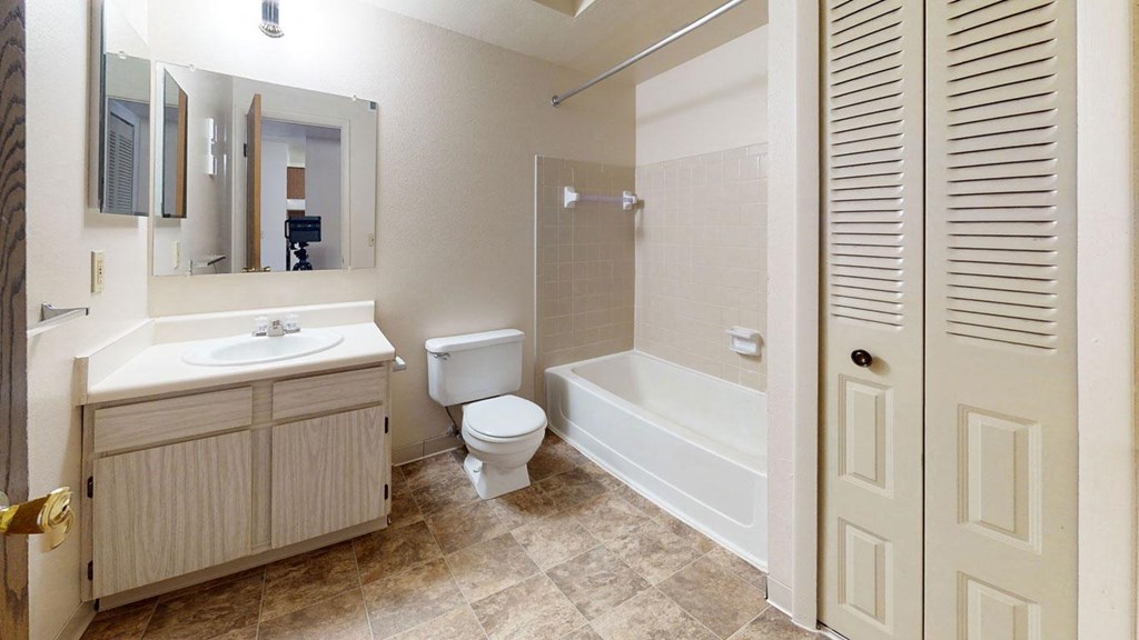 a bathroom with a linen closet at Walnut Trail Apartments in Portage, MI 49002