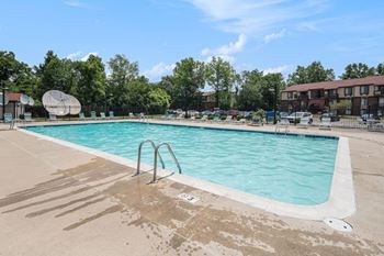 Outdoor Pool with Lounge Chairs at West Wind Apartments in Fort Wayne, Indiana