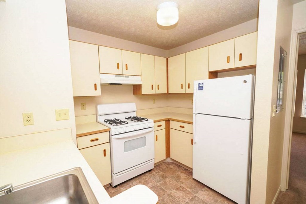 two bedroom kitchen with white appliances