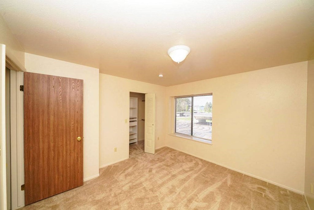 second bedroom with a walk-in closet