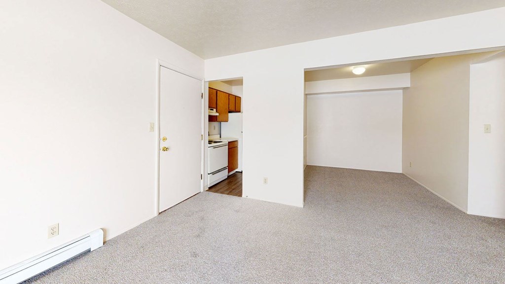 living and dining areas with plush carpeting  at Wood Creek Apartments, Kenosha, WI