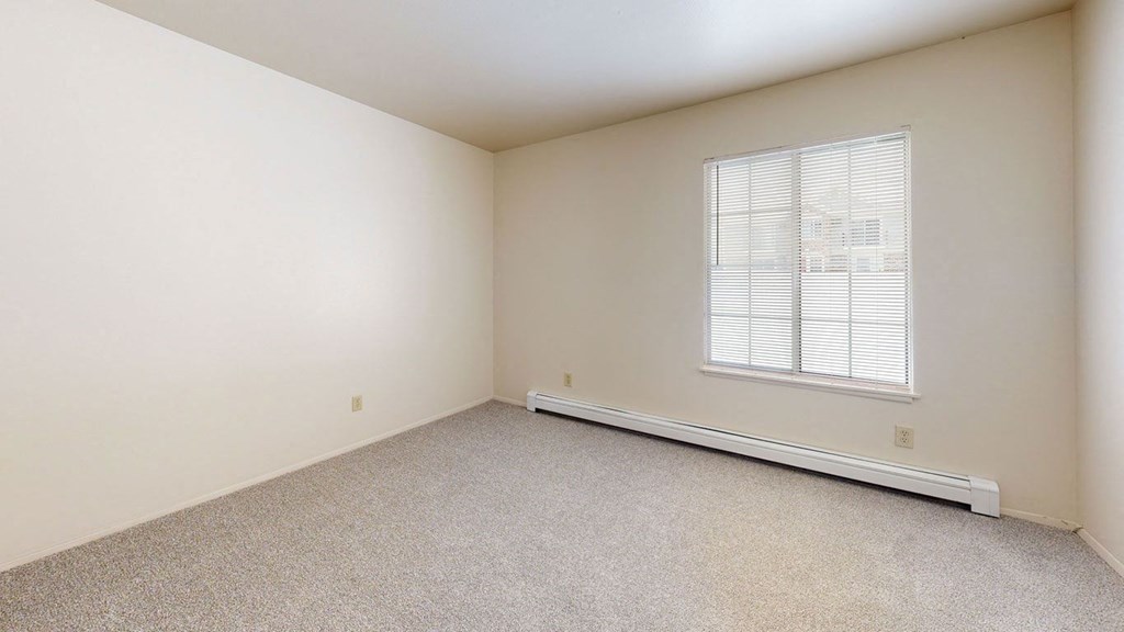 bedroom with a large window  at Wood Creek Apartments, Kenosha, WI, 53144