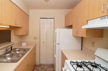 kitchen with a breakfast bar and pantry  at Wood Creek Apartments, Kenosha