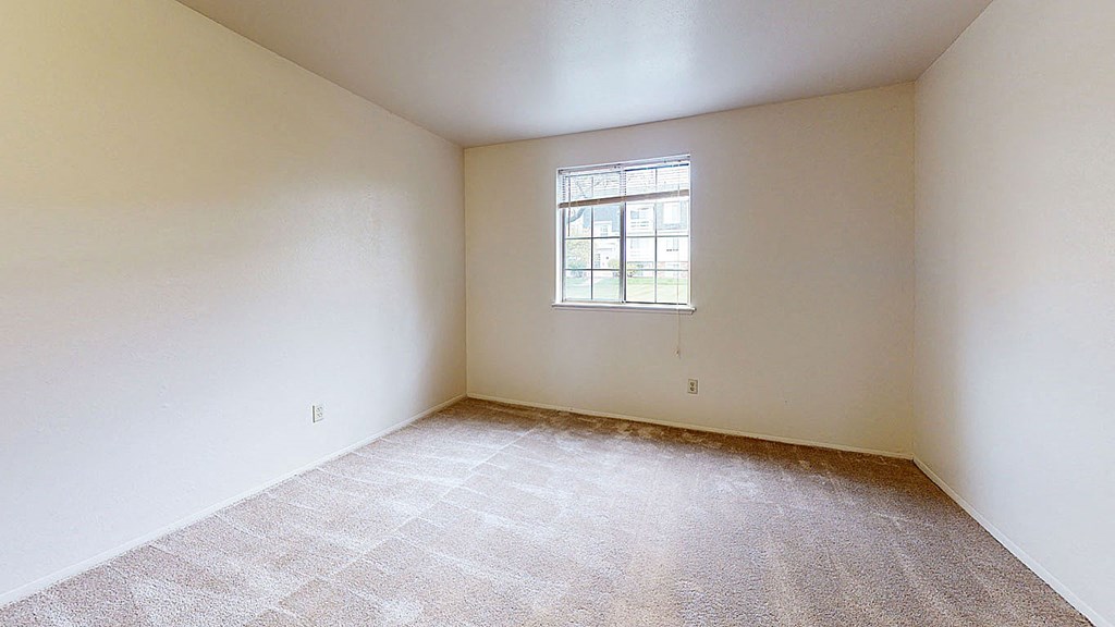 spacious bedroom with plush carpeting  at Wood Creek Apartments, Wisconsin