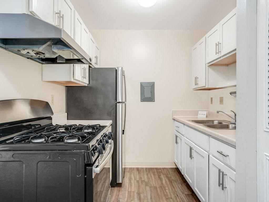 White Shaker-Style Cabinetry Private Balcony at Wood Creek Apartments in Kenosha, WI
