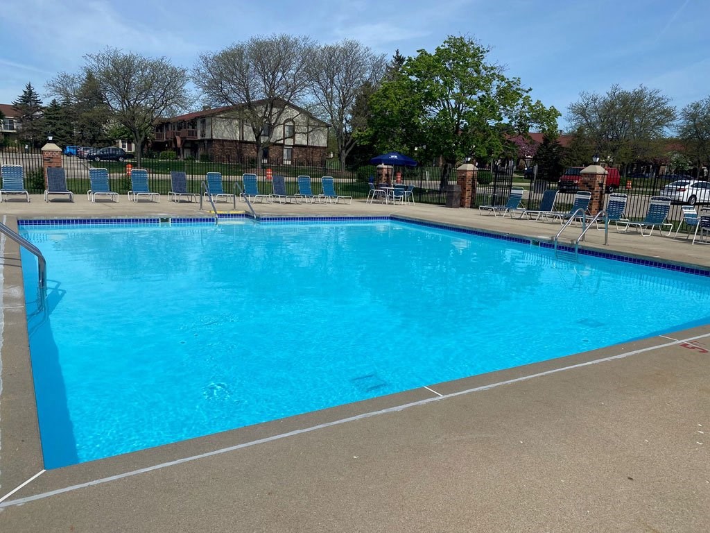 Outdoor Pool with Large Sundeck at Wood Creek Apartments, Kenosha, WI
