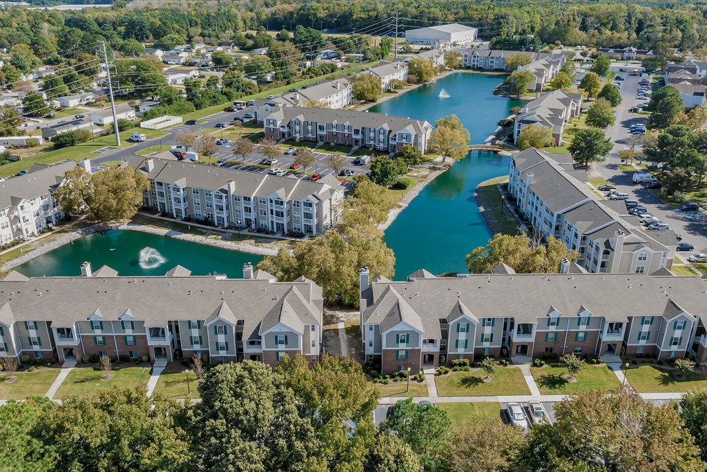 an aerial view of building and lake at WaterFront Apartments, Virginia