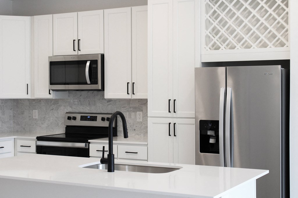 a kitchen with white cabinets and stainless steel appliances  at Avant & Avant II, Carmel, 46032