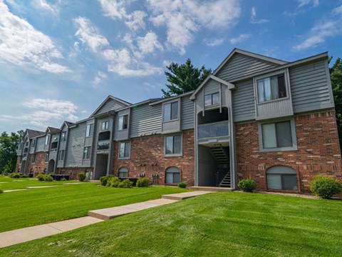 Apartment buildings with balconies and green lawn at Arbor Lakes Apartments, Indiana, 46516