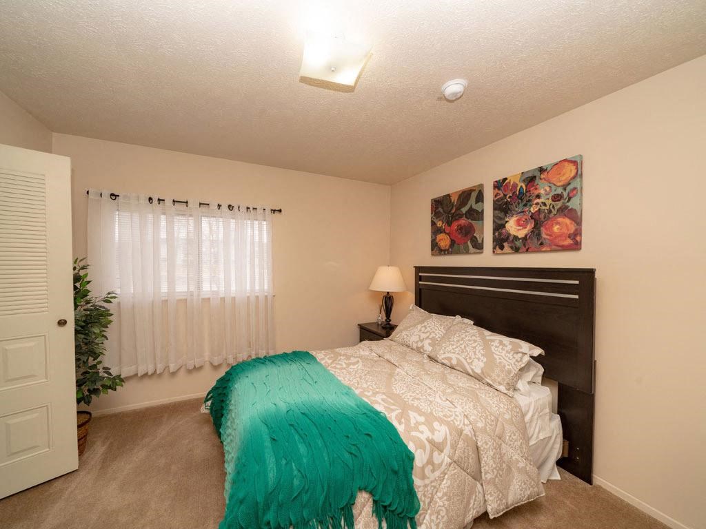Bedroom With Expansive Windows at Arbor Lakes Apartments, Elkhart