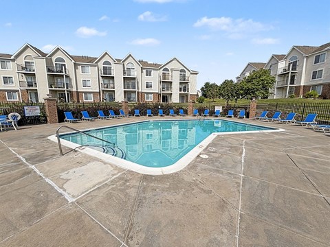 Community swimming pool with lounge chairs and apartment views at Black Sand Apartments Homes, Nebraska, 68504