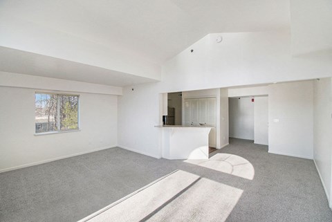 Open concept living area with vaulted ceilings at Brentwood Park Apartments, La Vista, NE