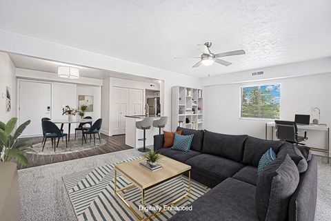 A living room with a grey couch and a coffee table.