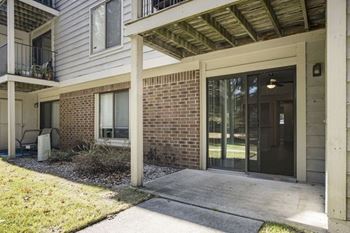 Private patio or balcony with storage at Byron Lakes Apartments in Byron Center, MI