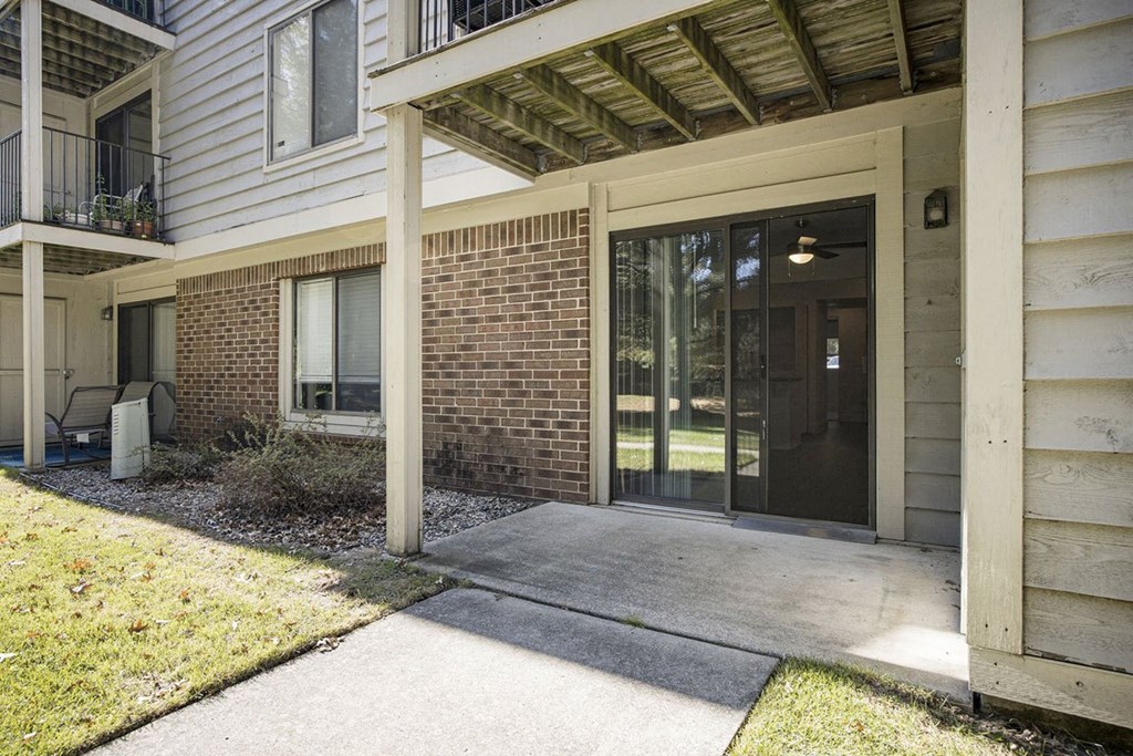 patio with slider and enclosed storage  at Byron Lakes Apartments, Byron Center, MI