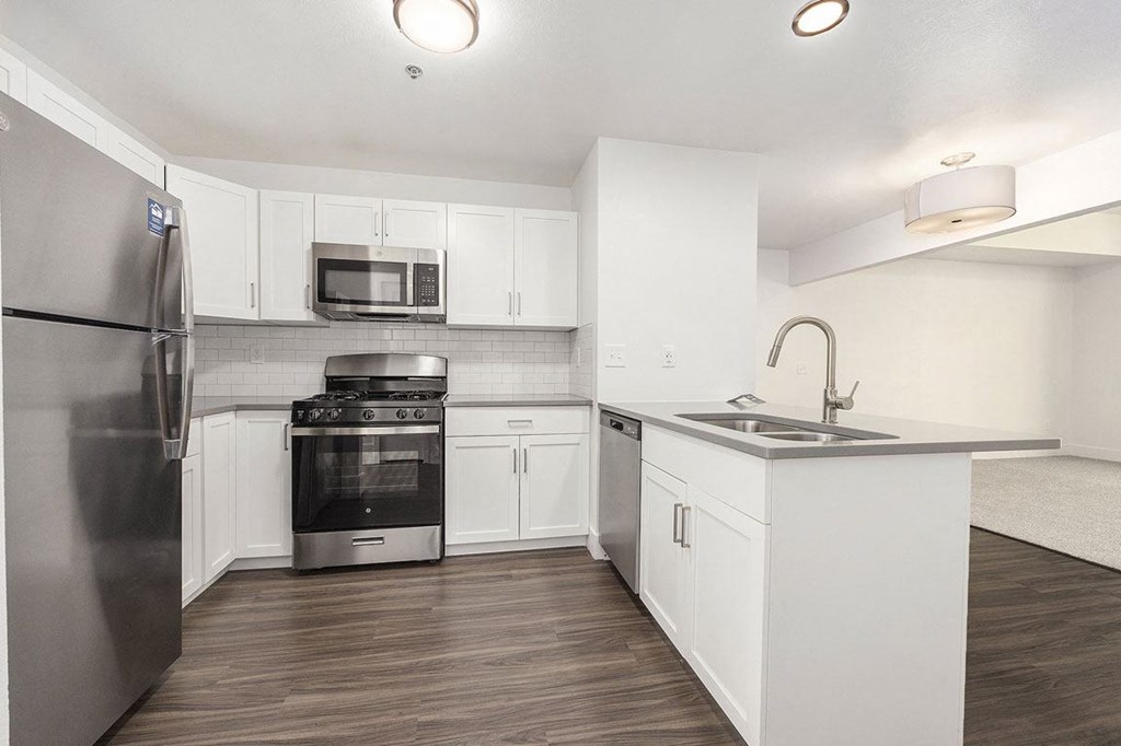 Stylish Kitchen with Breakfast Bar at Byron Lakes Apartments, Byron Center, MI, 49315