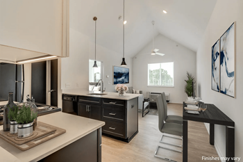 a kitchen and dining area in a 555 waverly unit  at Uptown Square Apartments, Troy, 48083