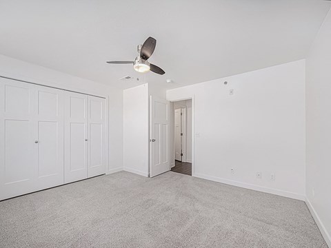 A bedroom with a ceiling fan and carpeted floor at Chase Creek Apartment Homes, Huntsville, AL, 35811