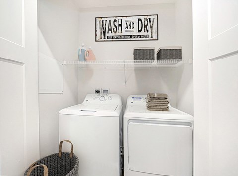 A laundry room with a washer and dryer at Chase Creek Apartment Homes, Huntsville, AL, 35811