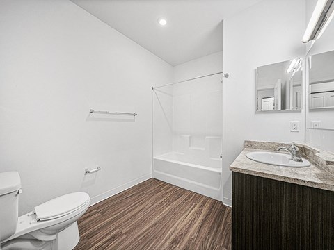 a bathroom with a toilet sink and showe rat Chase Creek Apartment Homes, Alabama, 35811