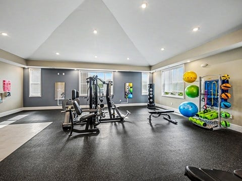 Fitness center with exercise equipment and colorful stability balls at Chase Creek Apartments Homes, Huntsville, 35811